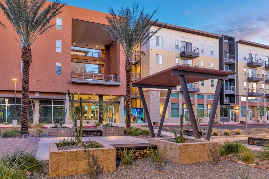 a building with palm trees in front of it