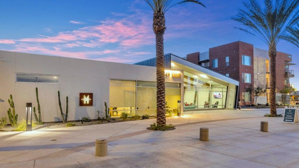 a building with a palm tree in front of it