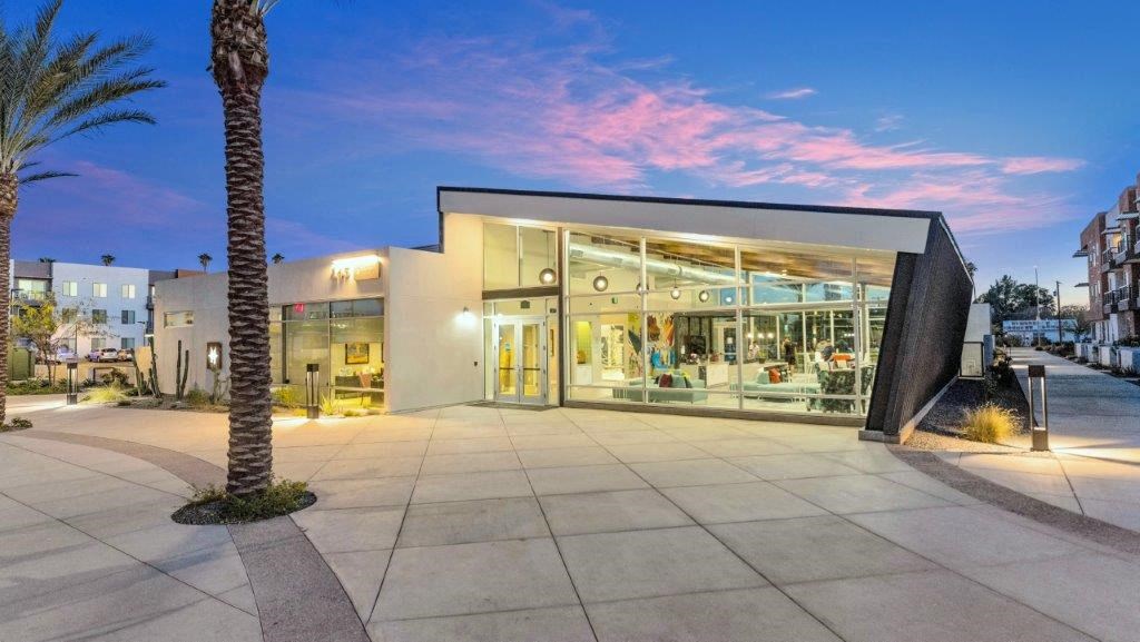 a building with a palm tree in front of it