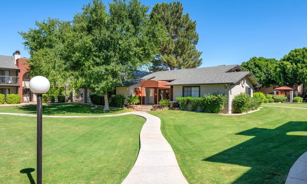 a sidewalk in front of a house