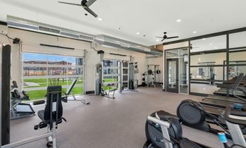 the property has a gym with a treadmill and elliptical machines  at Glen 91, Glendale, AZ