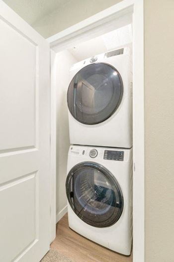 a washing machine and dryer in a small closet