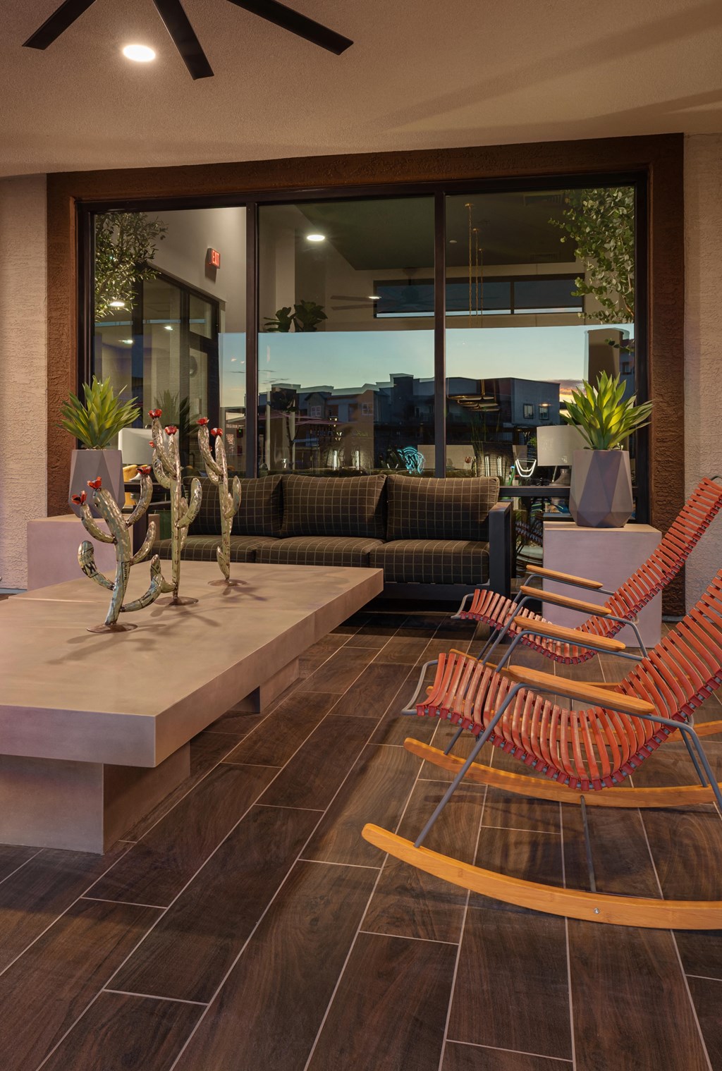 the lobby of a hotel with chairs and a coffee table at Weylyn Luxury Apartments, Laveen, Arizona