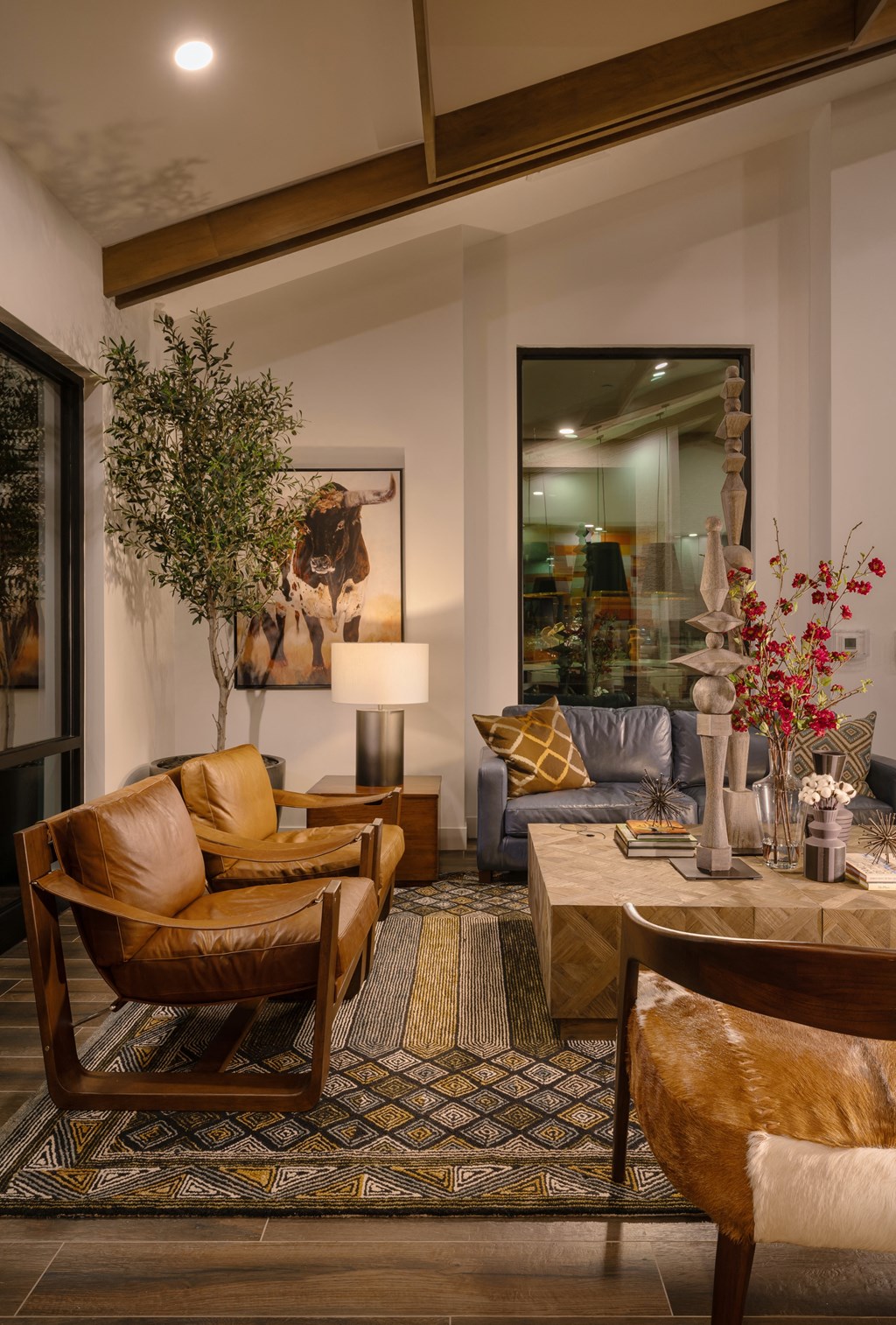 a living room with leather furniture and a large mirrorat Weylyn Luxury Apartments, Arizona, 85339