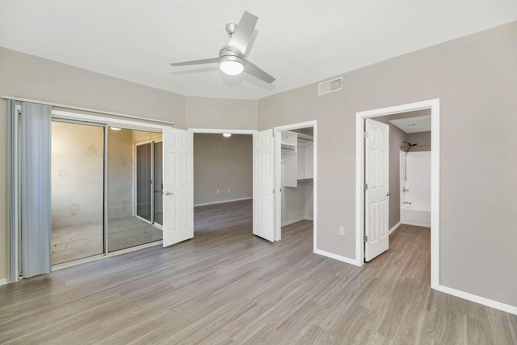a view of a room with mirrored closets