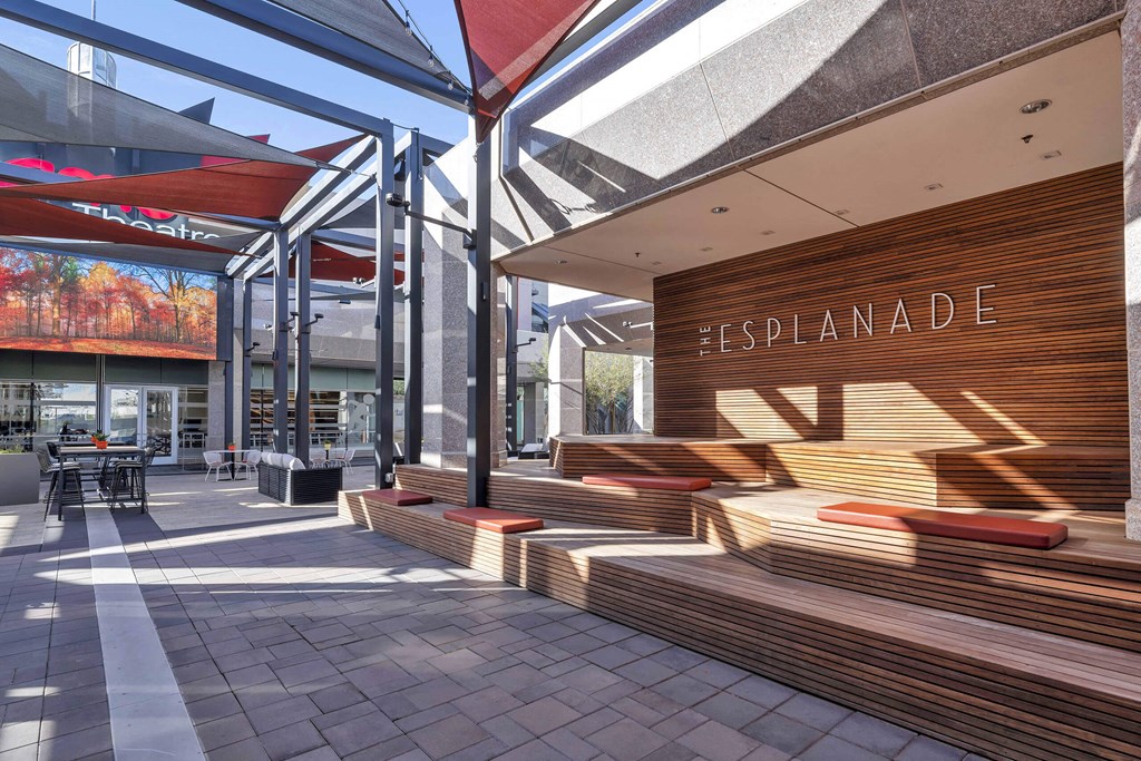 a rendering of the entrance to a restaurant with wooden benches