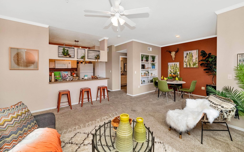 A living room with a couch, chairs, and a coffee table at Montage at Pecos Ranch Apartments, Arizona