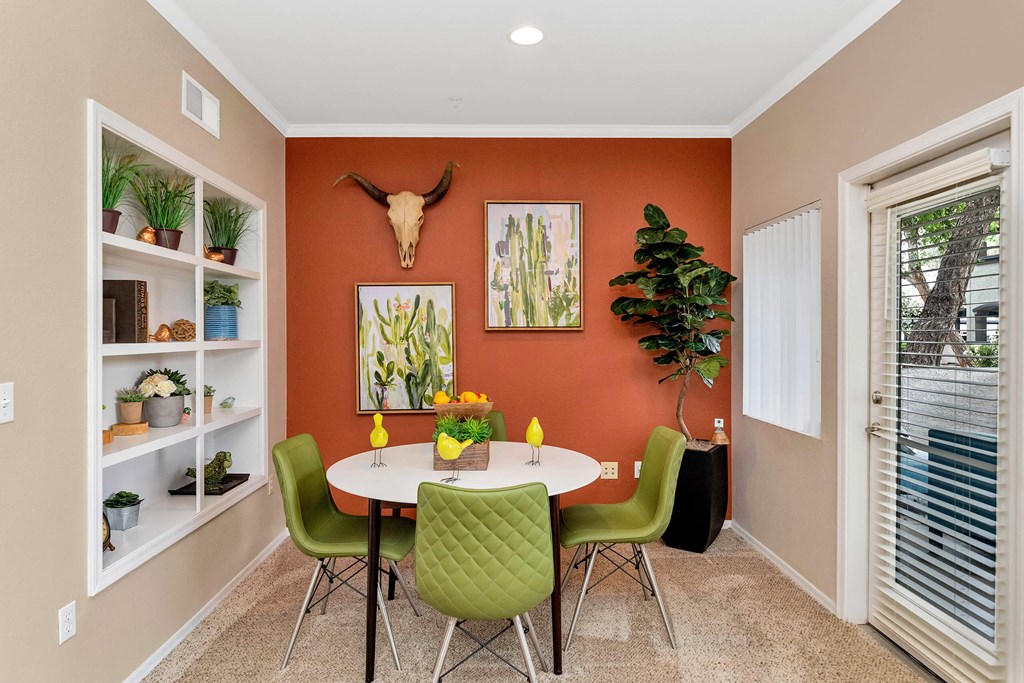 a dining room with a table and chairs and a window a dining room with a table and chairs and a window at Montage at Pecos Ranch Apartments, Arizona, 85286