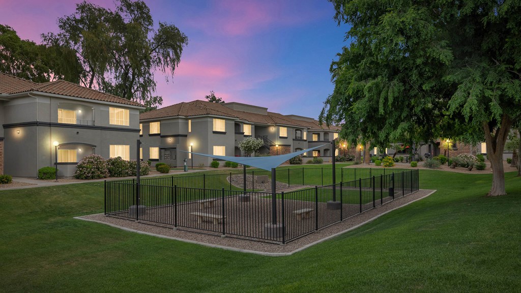 A residential area with houses and a fenced garden at Montage at Pecos Ranch Apartments, Arizona, 85286