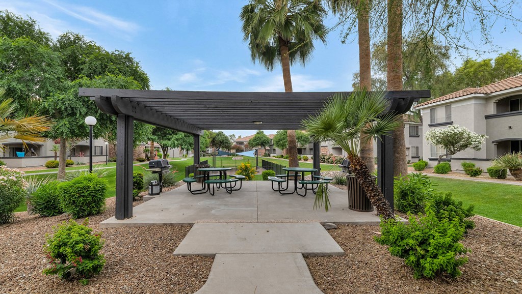 A park with a pavilion, benches, and trees at Montage at Pecos Ranch Apartments, Chandler, Arizona