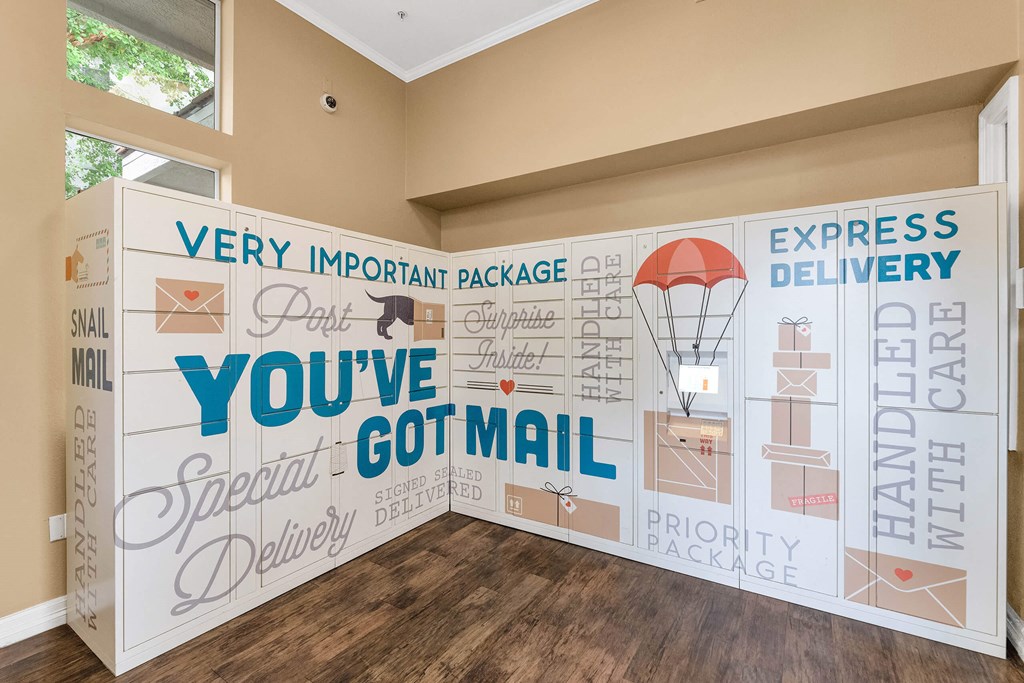 A wall with a mail related theme and the words  at Montage at Pecos Ranch Apartments, Chandler