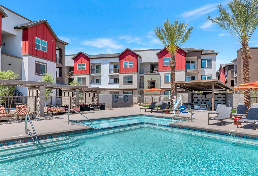 our apartments have a swimming pool with a lot of chairs and umbrellasat Weylyn Luxury Apartments, Arizona