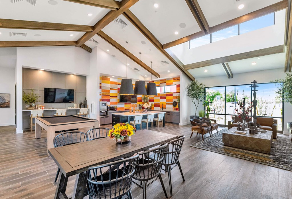 a living room with a dining room table and a kitchenat Weylyn Luxury Apartments, Laveen, AZ 85339