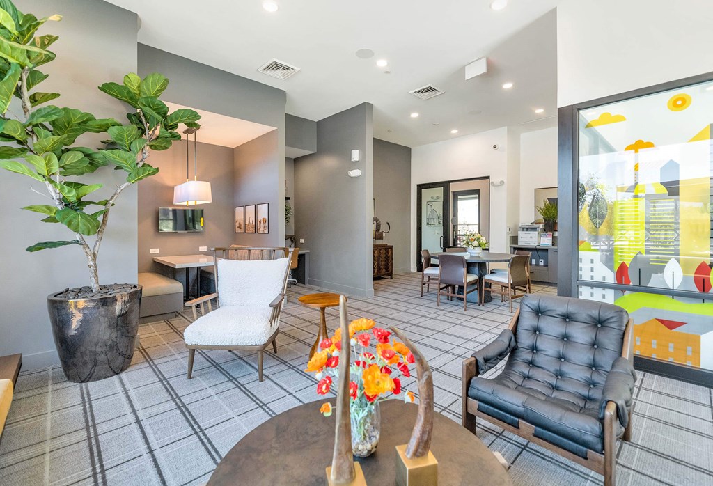 a living room with chairs and a tableat Weylyn Luxury Apartments, Laveen, 85339
