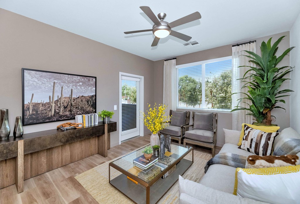 a living room with a couch and a ceiling fanat Weylyn Luxury Apartments, Arizona