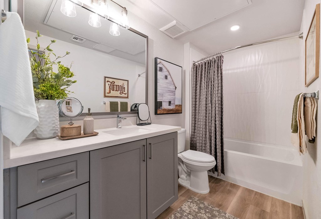 a bathroom with a shower and a sink and a toilet at Weylyn Luxury Apartments, Arizona