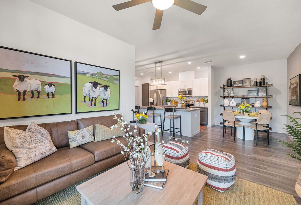 a living room with a couch and a tableat Weylyn Luxury Apartments, Arizona