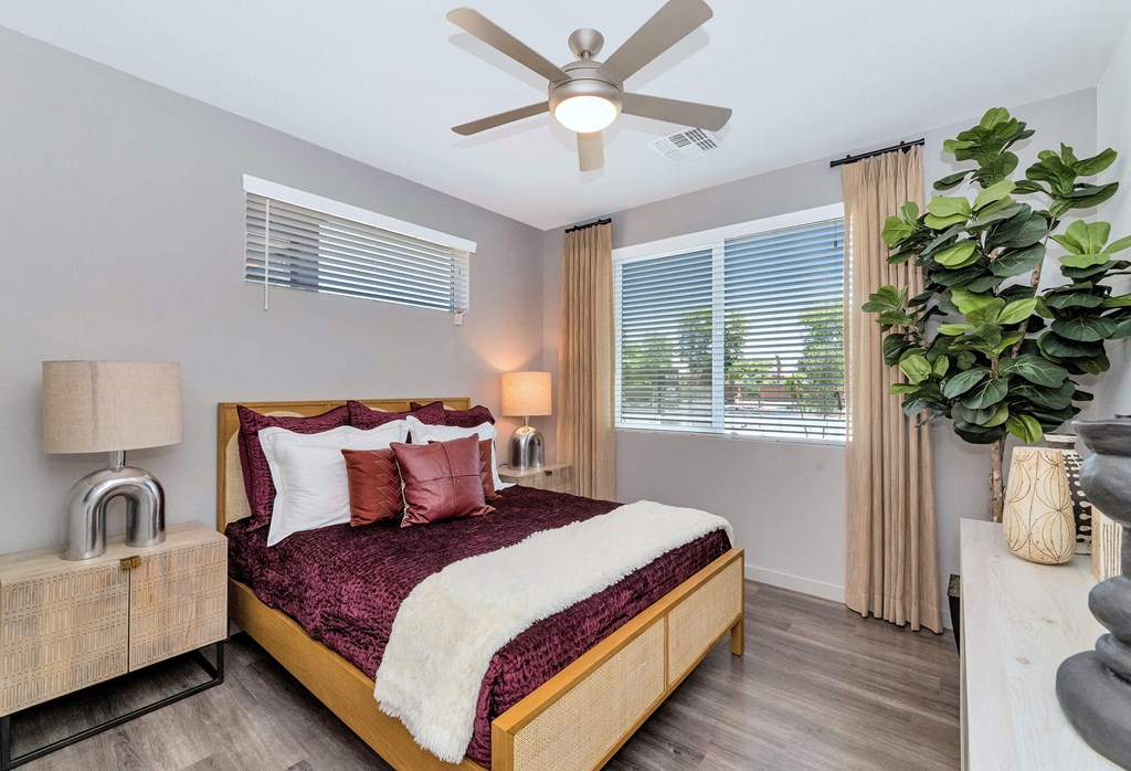 a bedroom with a bed and a ceiling fanat Weylyn Luxury Apartments, Laveen, 85339