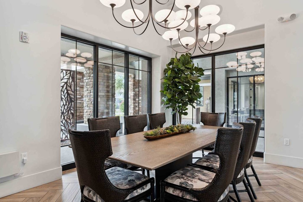 A dining room with a wooden table and chairs. at The Laurel Apartments, Chandler, 85286