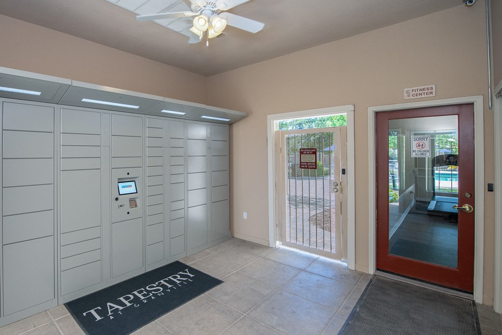 a garage with a door and a ceiling fan
