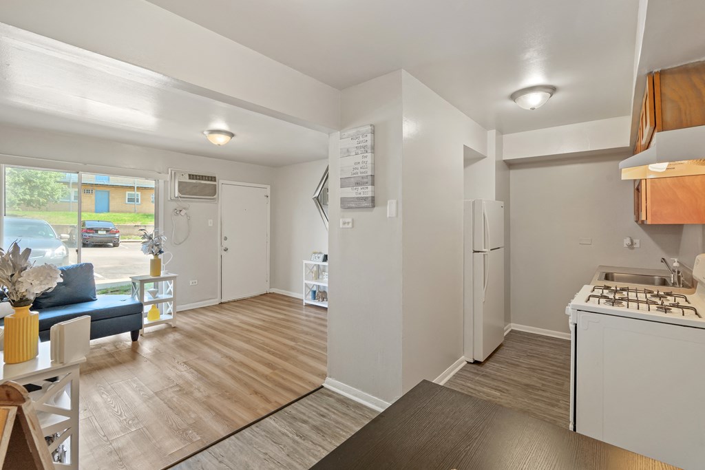 a kitchen and living room in a 555 waverly unit