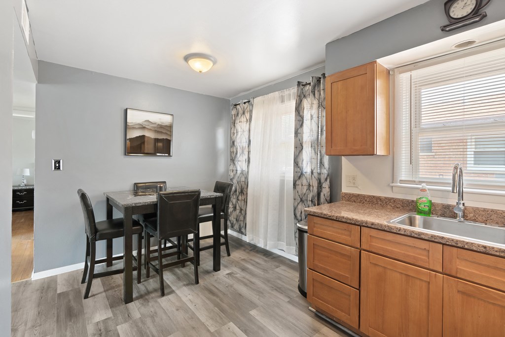 a kitchen and dining area in a 555 waverly unit