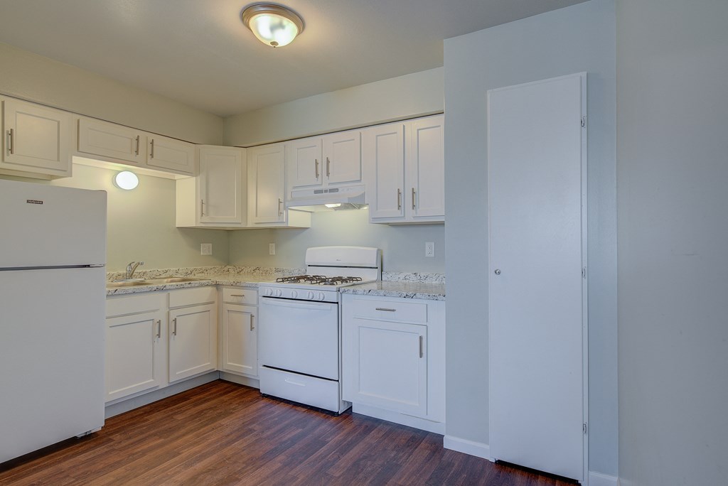 Kitchen With White Cabinetry And Appliances at Johnson Legacy Apartments, Milwaukee, WI, 53223