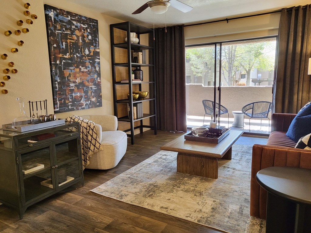 a living room with a couch coffee table and bookshelf