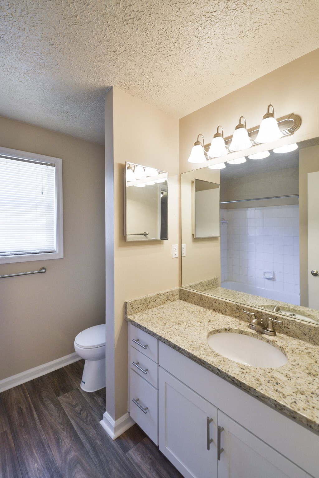 Bathroom with Wood Floors at Apartments in Smyrna Georgia 30082