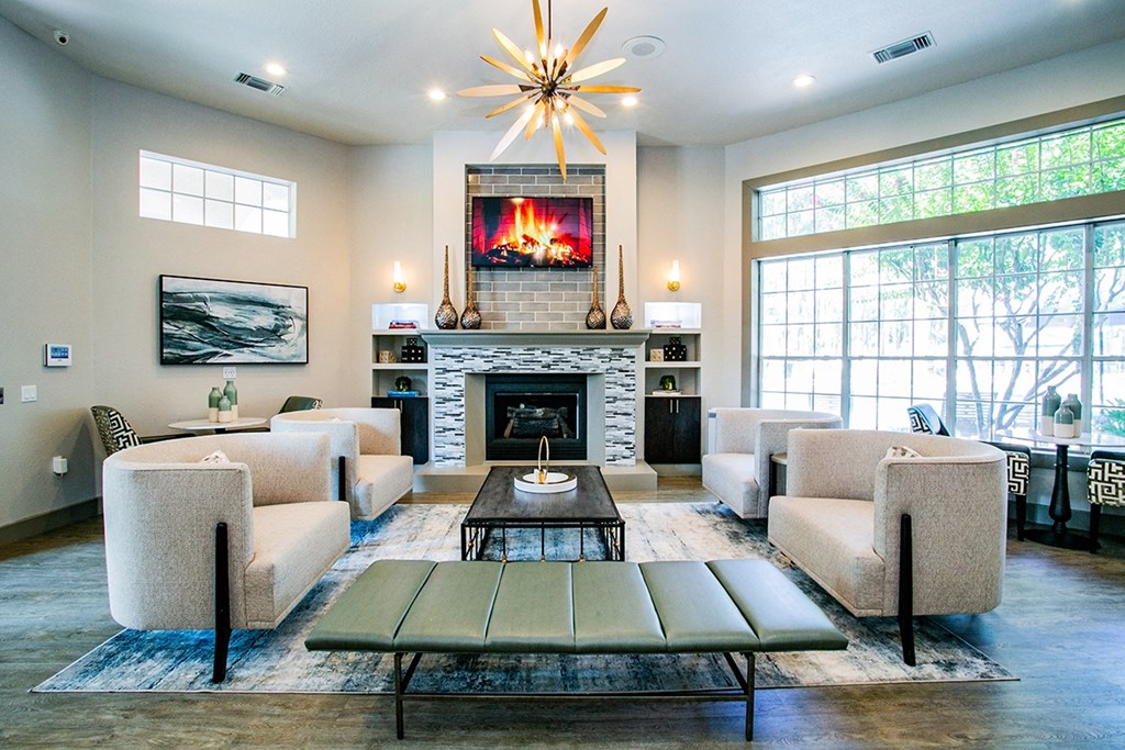 a living room with a fireplace and a large window