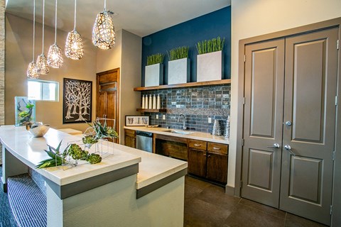 a kitchen with a counter top and a sink