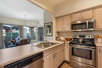 White Countertops in Apartment Kitchen - Photo Gallery 8