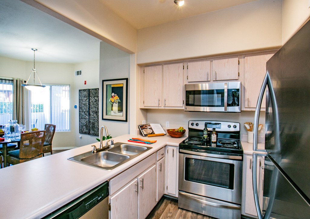 Updated kitchen with stainless steel appliances and white counter tops Apartments in Las Vegas