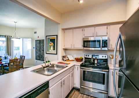 Updated kitchen with stainless steel appliances and white counter tops Apartments in Las Vegas
