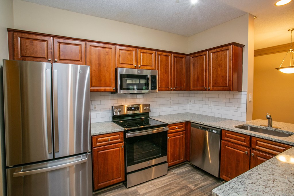 Full Kitchen with Granite Countertops at Best Rated Apartments in Atlanta