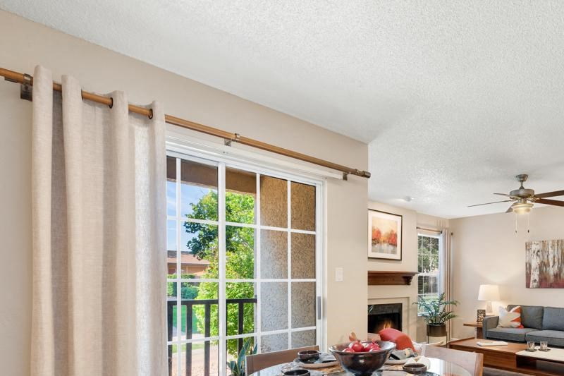 Spacious Apartment Dining Room with Faux Wood Flooring