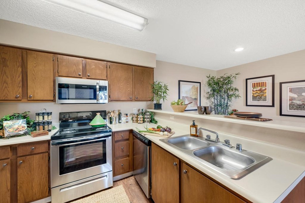 Stainless steel appliances in apartment kitchen at River Walk