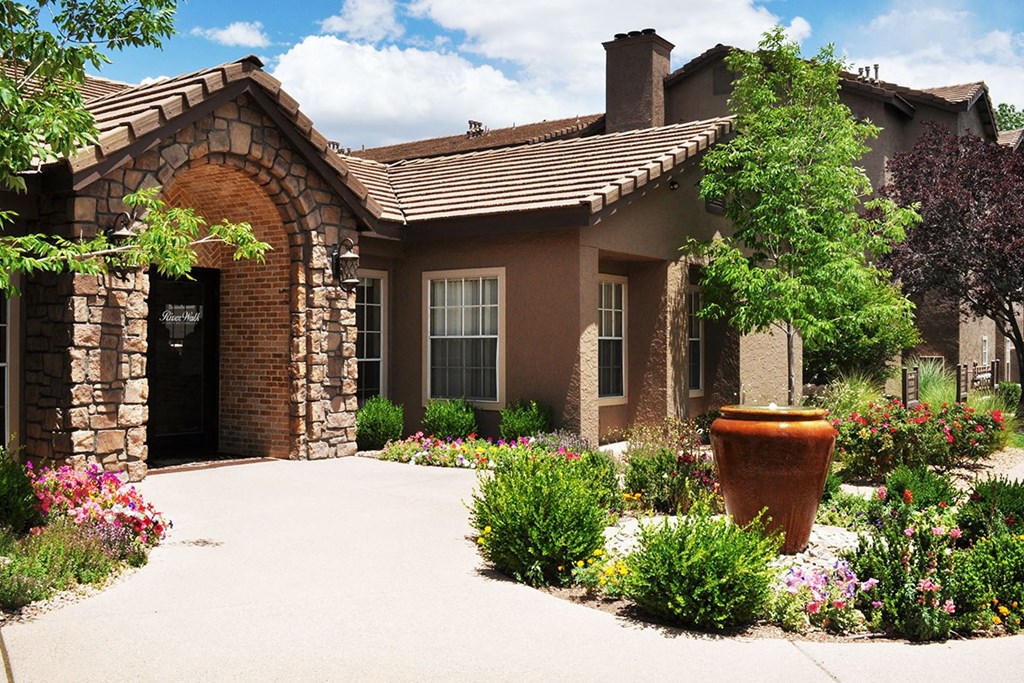 Leasing Office stone exterior of River Walk at Puerto de Corrales Apartments