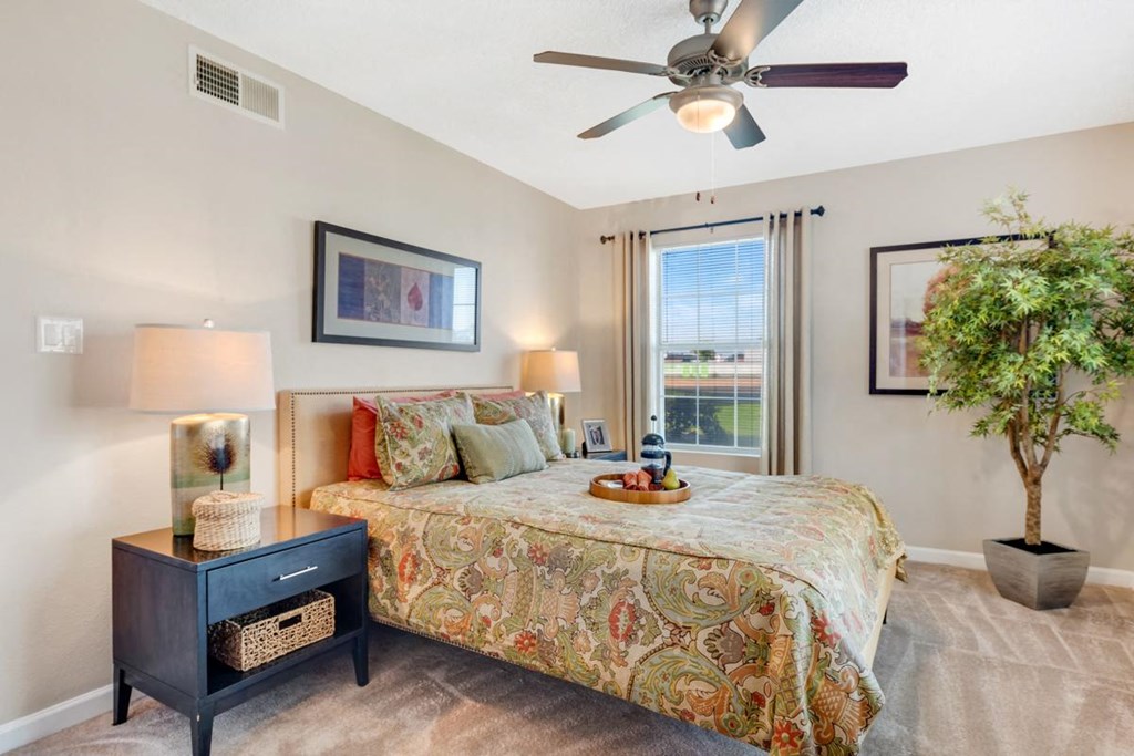Light color apartment bedroom with tall window