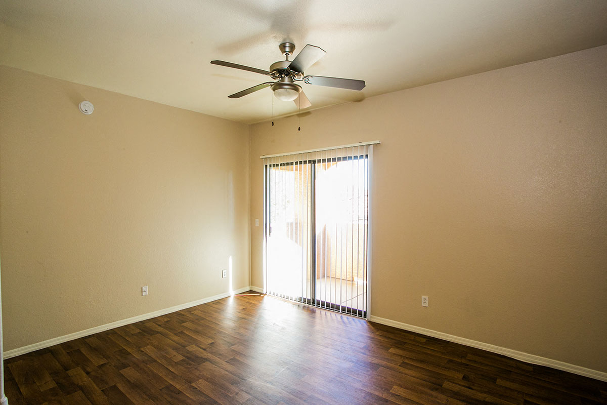 Spacious Living Room with Ceiling Fan at Best Apartments in Phoenix