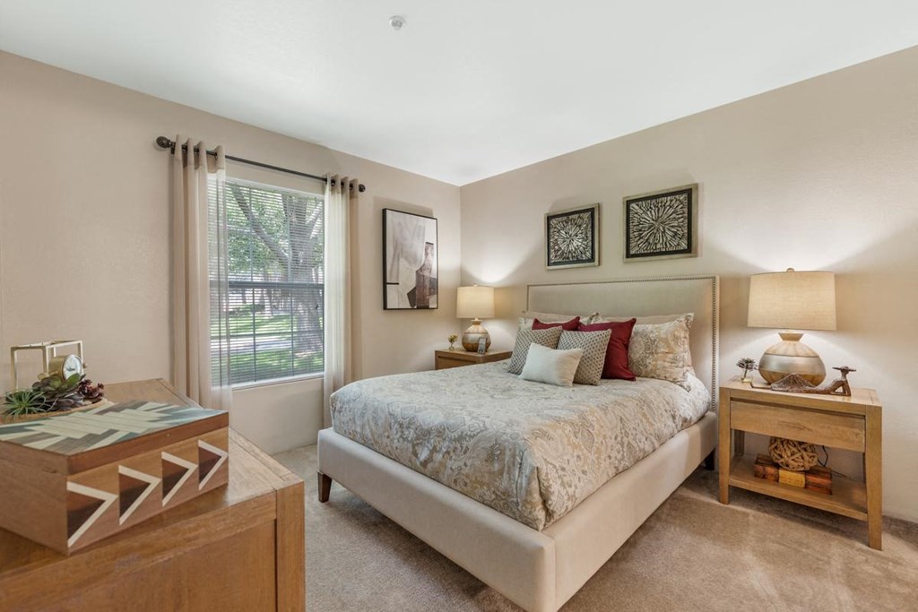 Bed and Nightstand in 1, 2, 3 Bedroom Apartments NM