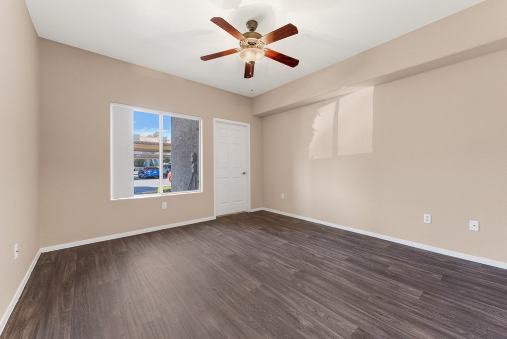 Vinyl wood floor apartment bedroom with ceiling fan