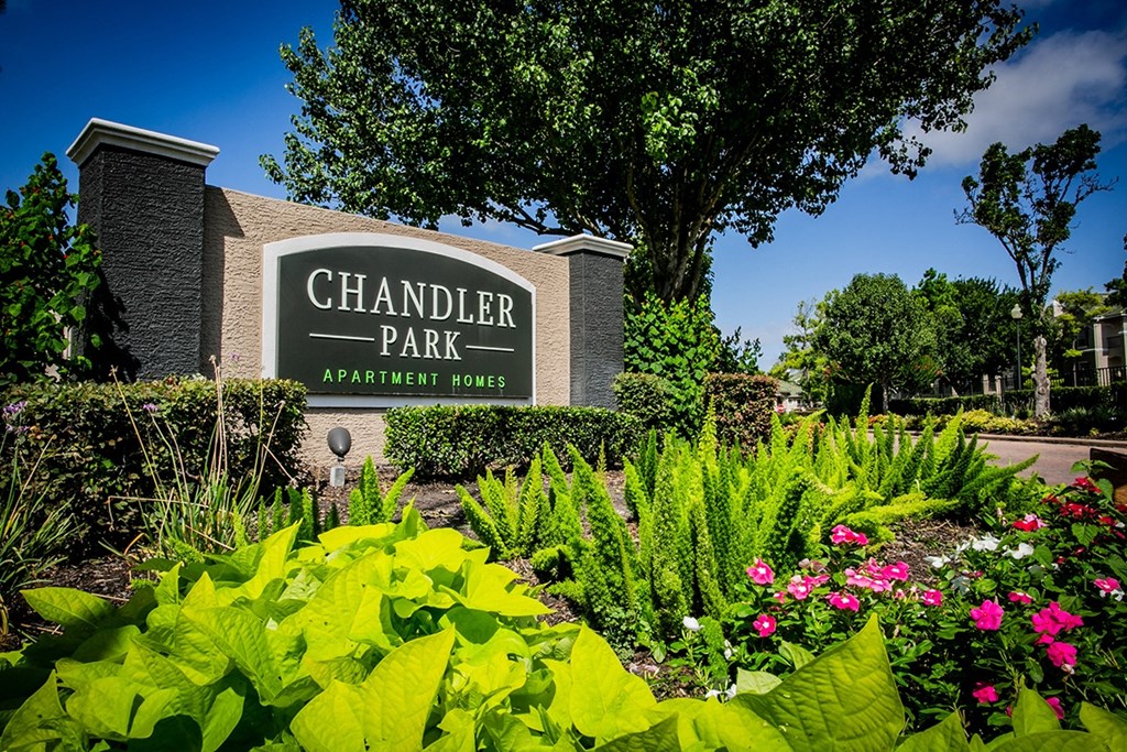 a building with a sign that says chandler park apartments