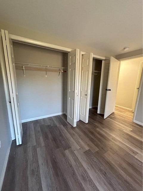A room with a grey floor and white walls.