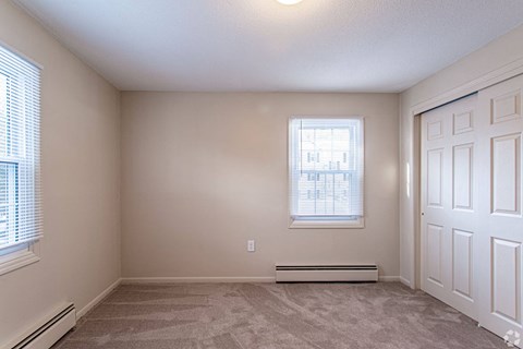 A room with a window and a door.