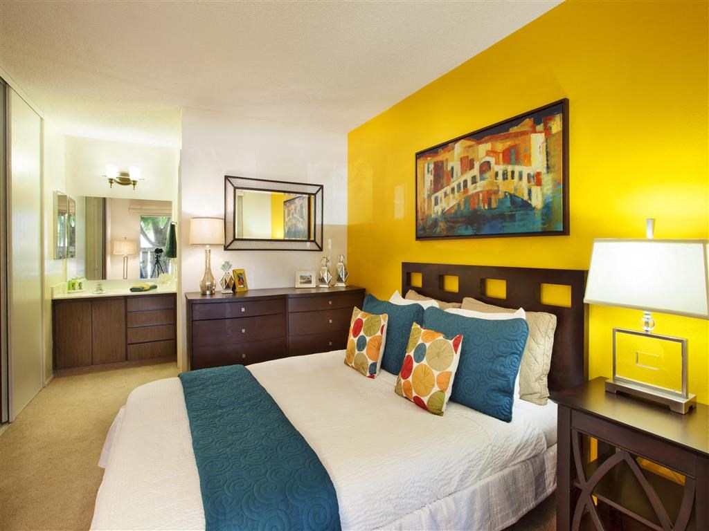 Two-Bedroom Apartments in Goleta, CA- Patterson Place- Wall Mirror with Hanging Artwork and Matching Bedroom Furniture
