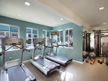 Fitness Center With Updated Equipment Fitness Center With Updated Equipment at Cypress Point Apartment , Ventura, CA - Photo Gallery 5