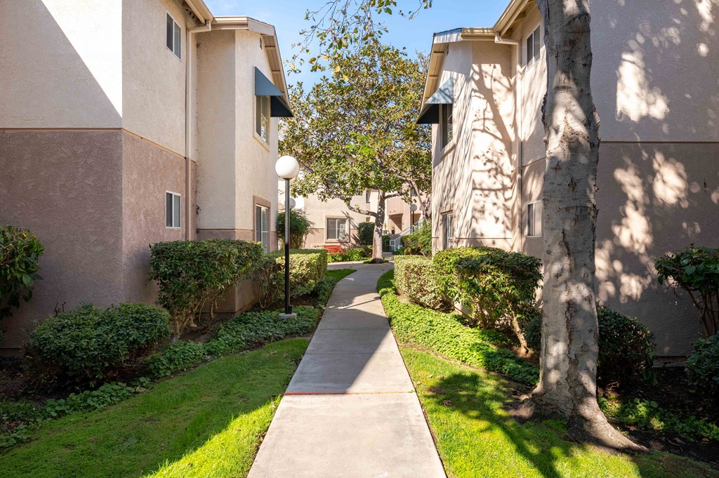 the walkway between the buildings at the apartments for rent