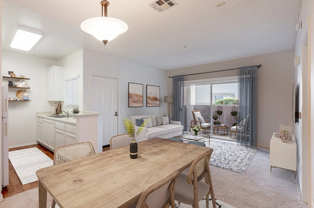 a living room and dining room with a wooden table