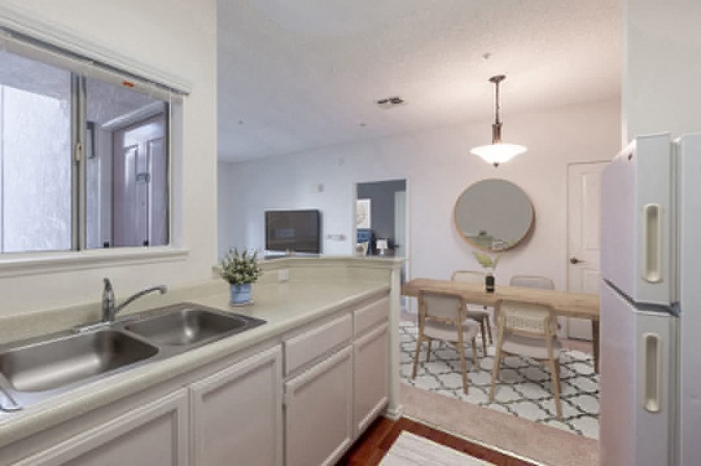 Retirement Homes in Ventura, CA - Cypress Meadows - Kitchen with Granite-Style Countertops and Spacious Windows